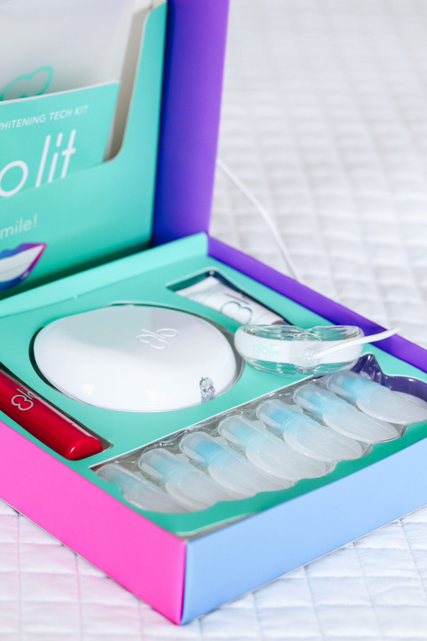 This image showcases one of my favorite purchases of 2020, the GLO Lit teeth whitening kit.